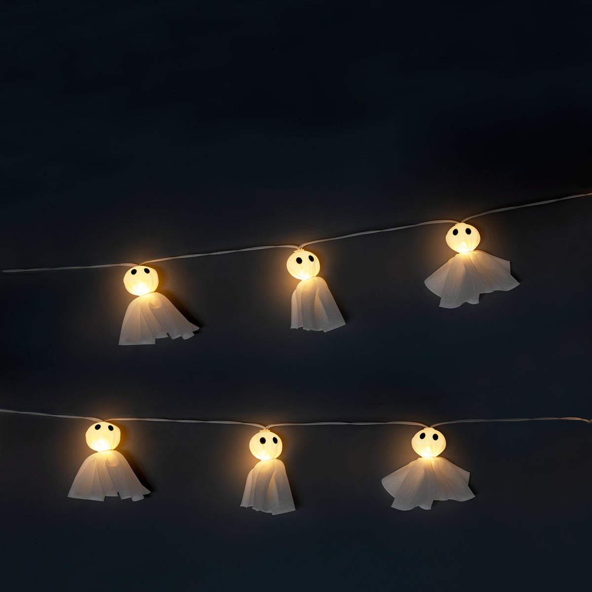 Decorative string lights with tulle ghost figures, 10-piece set from Flying Tiger Copenhagen for Halloween or home decor.