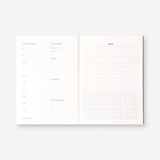 Flying Tiger Copenhagen gradient weekly study planner with colorful pages and spiral binding for organized office planning.