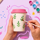 DIY to-go coffee mug by Flying Tiger Copenhagen, 360 ml ceramic mug with colorful hobby design and lid.