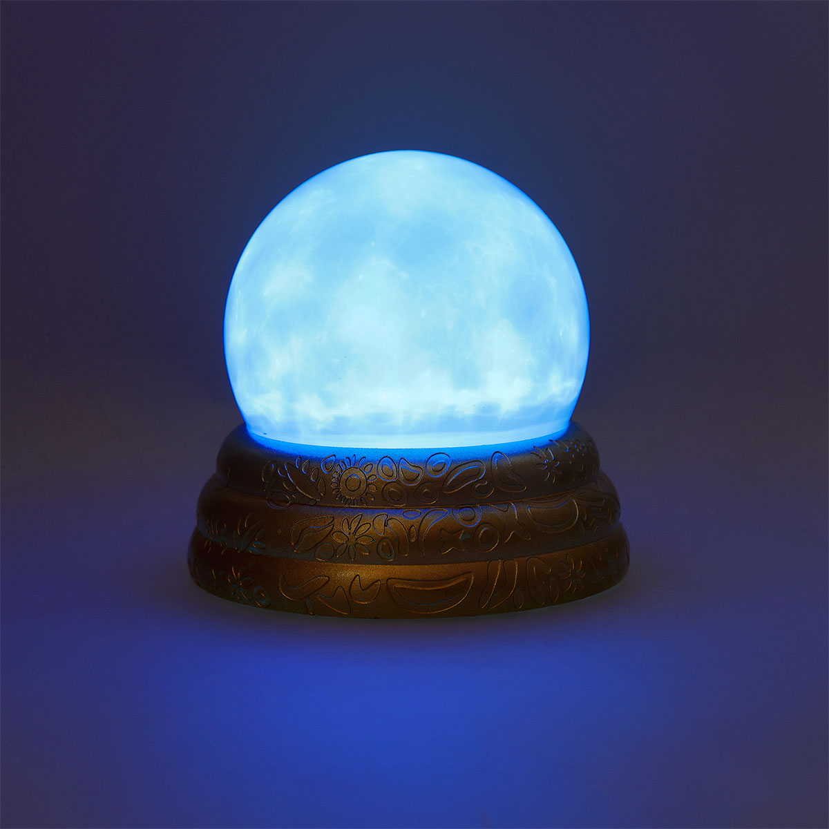 Flying Tiger Copenhagen scrying ball with light gadget showing a glowing glass sphere with swirling light effects.