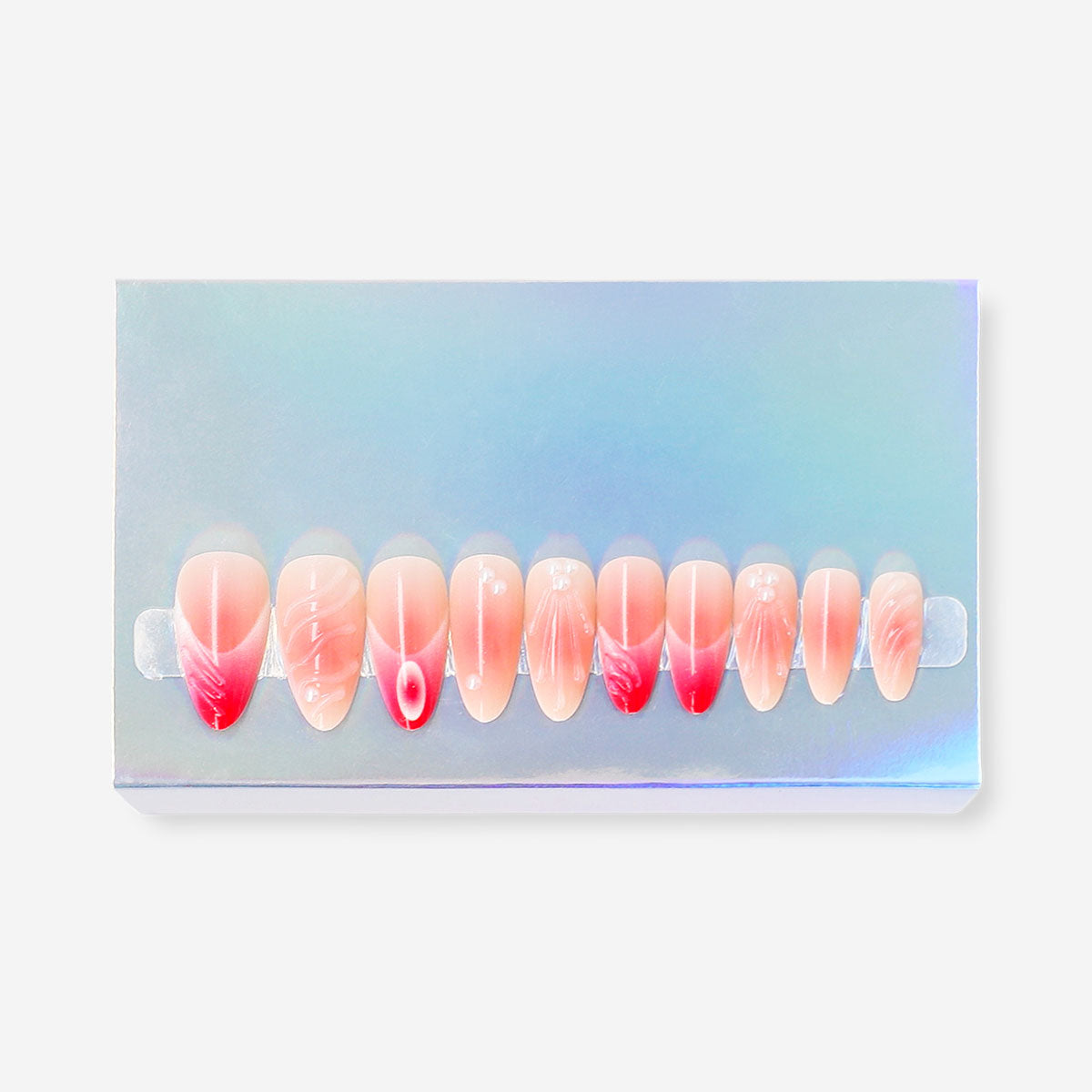 Pink press-on nails with pearl accents, designed for easy personal care application, by Flying Tiger Copenhagen.