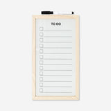Wood-framed Flying Tiger Copenhagen office planner board with marker for organizing and note-taking.