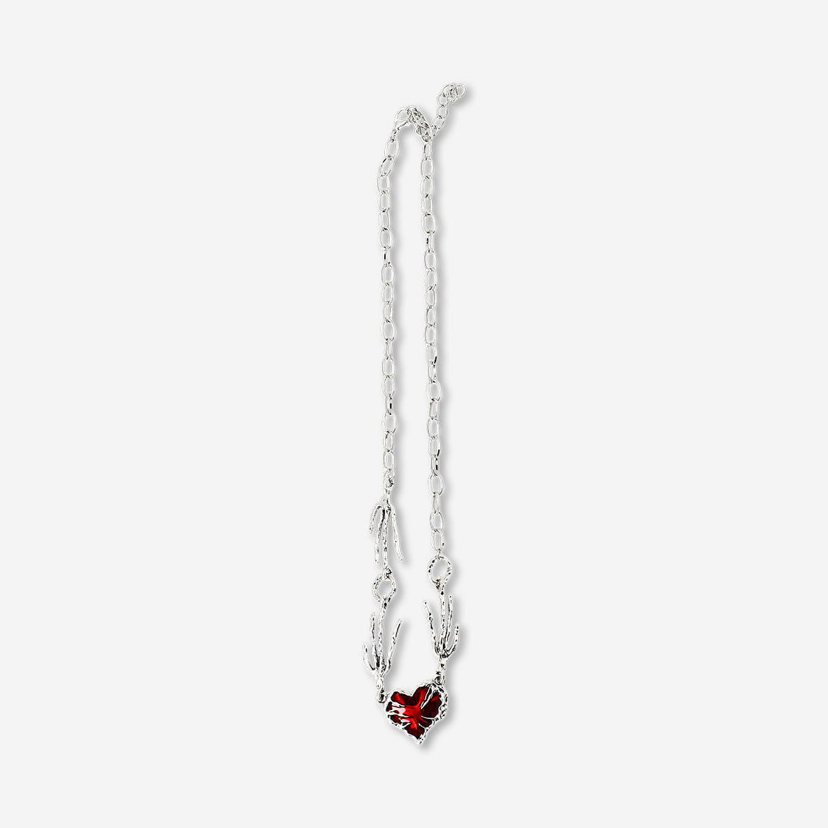 Silver textile necklace with a red heart pendant, stylish jewelry accessory from Flying Tiger Copenhagen.