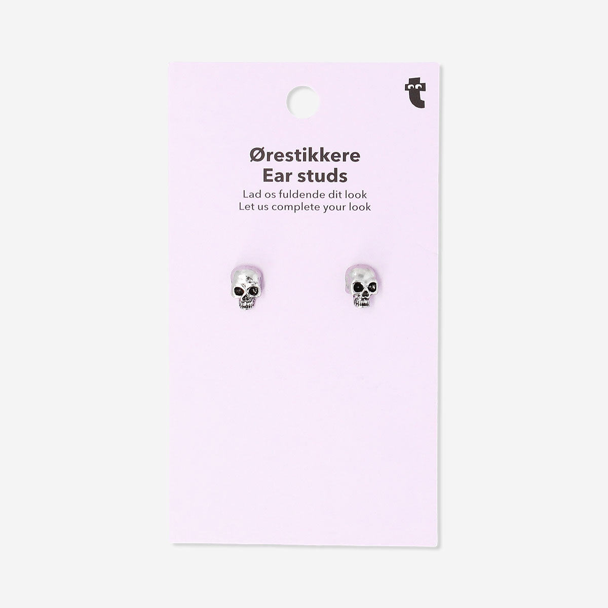 Silver skull stud earrings from Flying Tiger Copenhagen with textile backing, featuring small, detailed skull designs.