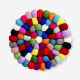 Colorful wool kitchen trivet from Flying Tiger Copenhagen featuring a vibrant, multi-colored woven design.