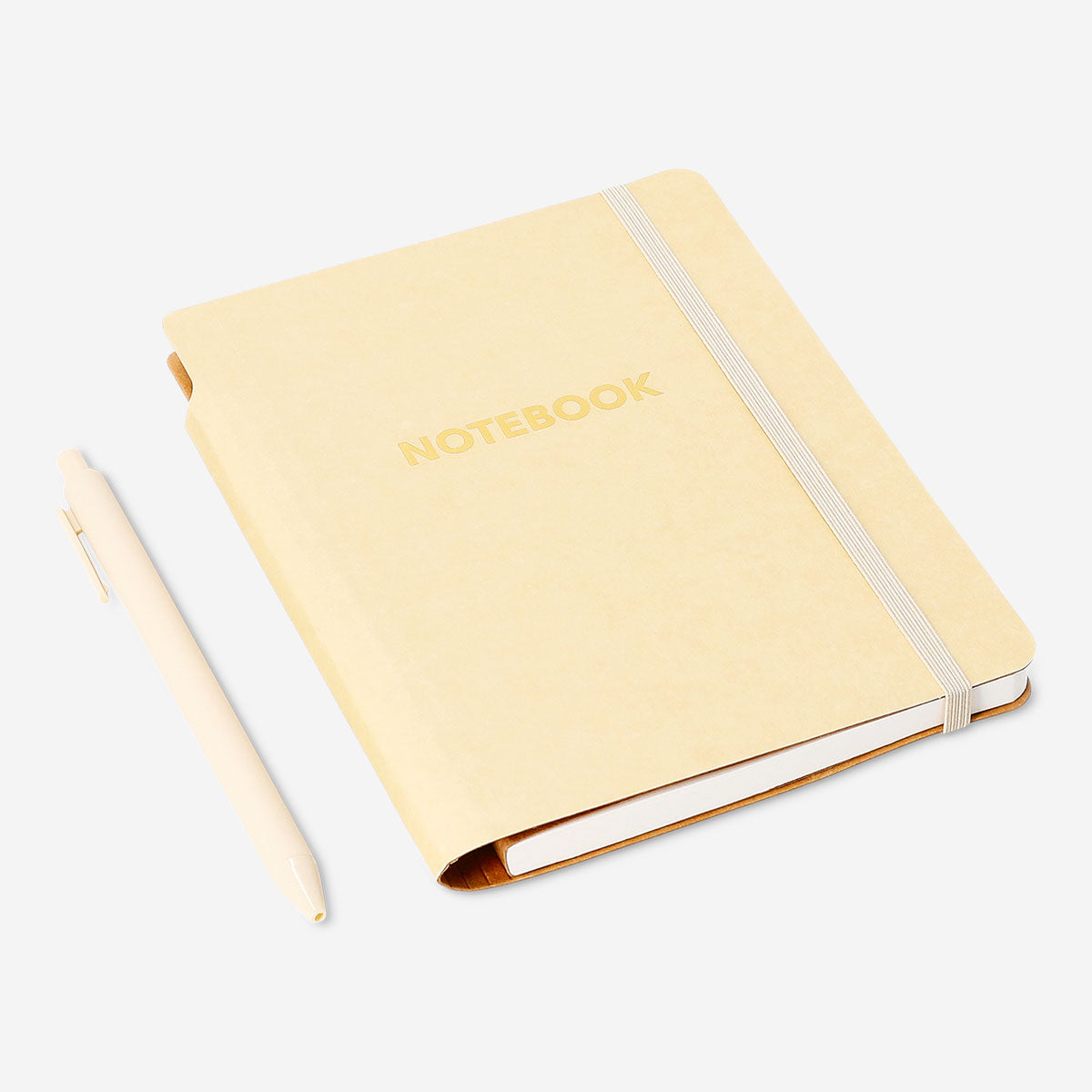 Butter yellow Flying Tiger Copenhagen office notebook with a matching ballpoint pen on a desk.