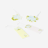 Four colorful flower gift tags for office use from Flying Tiger Copenhagen, featuring vibrant floral designs.
