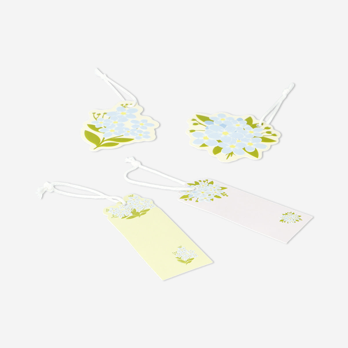 Four colorful flower gift tags for office use from Flying Tiger Copenhagen, featuring vibrant floral designs.