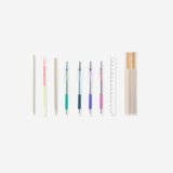 Set of nine Flying Tiger Copenhagen office pens in a box, featuring colorful ink and sleek design for everyday writing tasks.