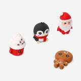 Set of four Flying Tiger Copenhagen Christmas character erasers, colorful office supplies shaped like festive holiday figures.