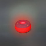 Pink doughnut-shaped gadget lamp by Flying Tiger Copenhagen with soft, cozy glow and playful design.