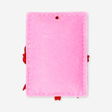 Felt hanging ornament shaped like a present, used for home decor, by Flying Tiger Copenhagen, displayed hanging on a wall.