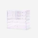 Clear cosmetic organiser from Flying Tiger Copenhagen with compartments, measuring 21.5x24 cm for personal care storage.