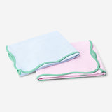 Set of two Flying Tiger Copenhagen kitchen tea towels with scalloped edges, featuring colorful patterns and soft cotton fabric.