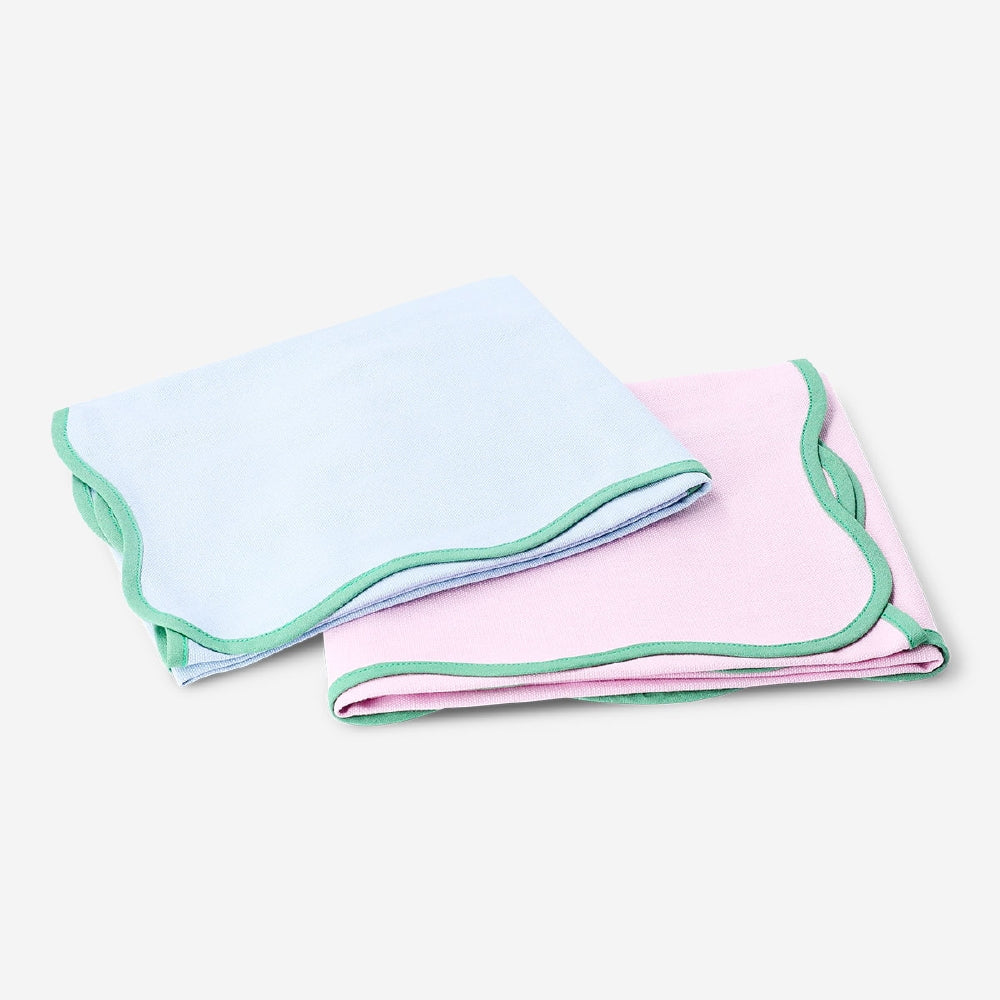 Set of two Flying Tiger Copenhagen kitchen tea towels with scalloped edges, featuring colorful patterns and soft cotton fabric.