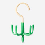 Green hook for scarves and belts from Flying Tiger Copenhagen, ideal for home organization and decorative storage.