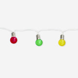Multi-colored outdoor string lights by Flying Tiger Copenhagen hanging outdoors, featuring vibrant bulbs for home decoration.
