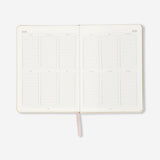 Flying Tiger Copenhagen B6 fabric cover daily diary 2027 in English, showing the textured fabric cover and pages inside.
