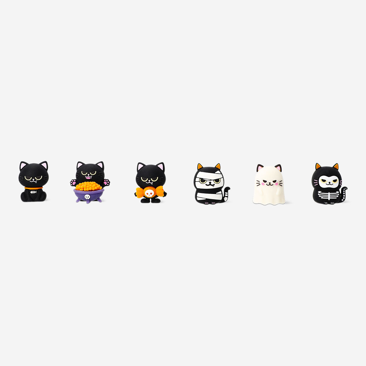 Colorful Halloween cats collectible toy set from Flying Tiger Copenhagen, featuring surprise-themed figurines for fun decoration.