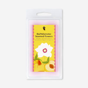 Scented flower wax melt from Flying Tiger Copenhagen with apricot and magnolia fragrance, showcasing colorful flower-shaped wax pieces.