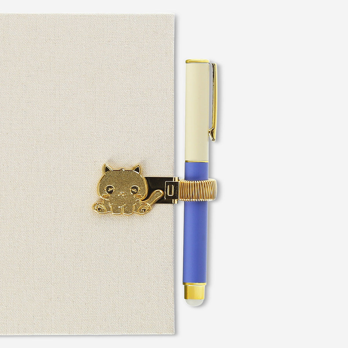 Gold cat pen loop from Flying Tiger Copenhagen, designed to attach to notebooks or planners for easy pen access.