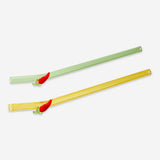 Two glass drinking straws with colorful chili pepper decorations, designed for kitchen use by Flying Tiger Copenhagen