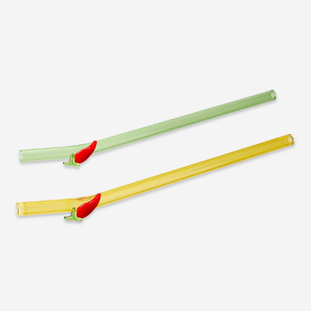 Two glass drinking straws with colorful chili pepper decorations, designed for kitchen use by Flying Tiger Copenhagen