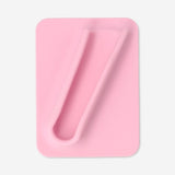 Pink lip gloss holder for phone cover by Flying Tiger Copenhagen, featuring a sleek design with a lip gloss compartment and phone attachment.