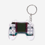 Flying Tiger Copenhagen game machine keyring featuring a compact gadget with multiple game options and colorful design.