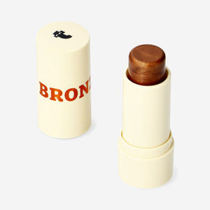 Flying Tiger Copenhagen bronzer stick for personal care, shown in a sleek, portable design with smooth application surface.