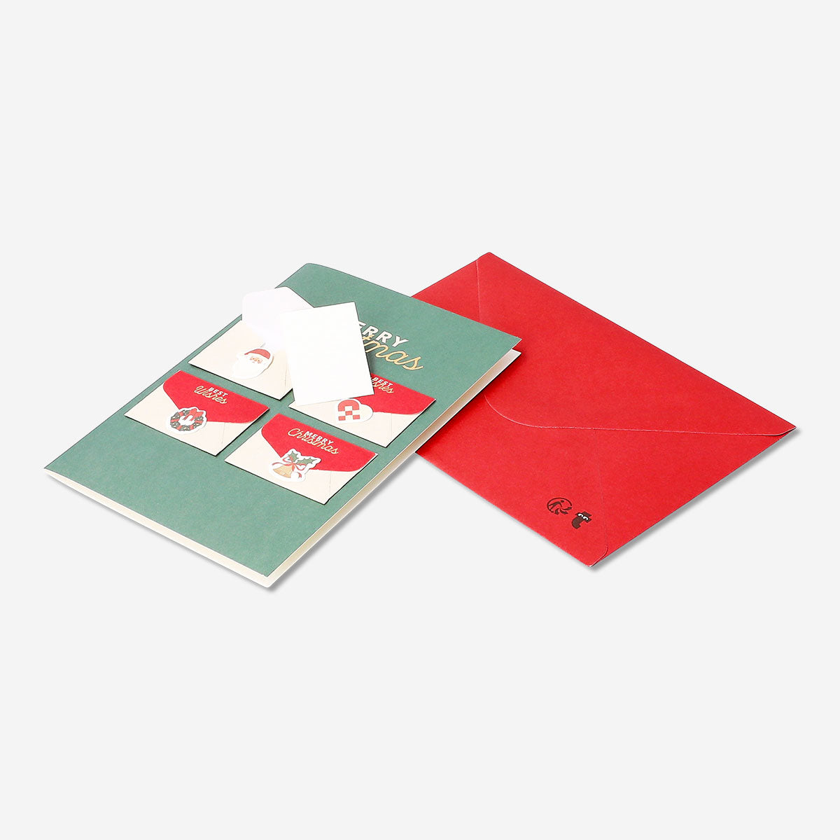 Office Christmas card with festive design and mini envelopes from Flying Tiger Copenhagen, perfect for holiday greetings.
