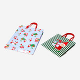 Two office gift bags with festive elf print designs by Flying Tiger Copenhagen, perfect for holiday gift wrapping.