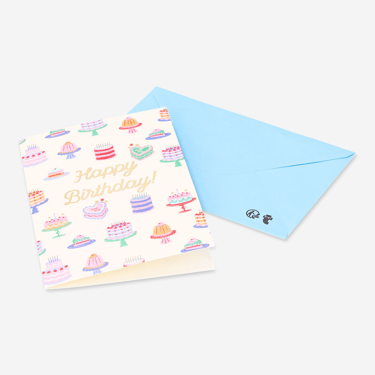 Office birthday card featuring colorful cake illustrations by Flying Tiger Copenhagen, perfect for celebrating special occasions.