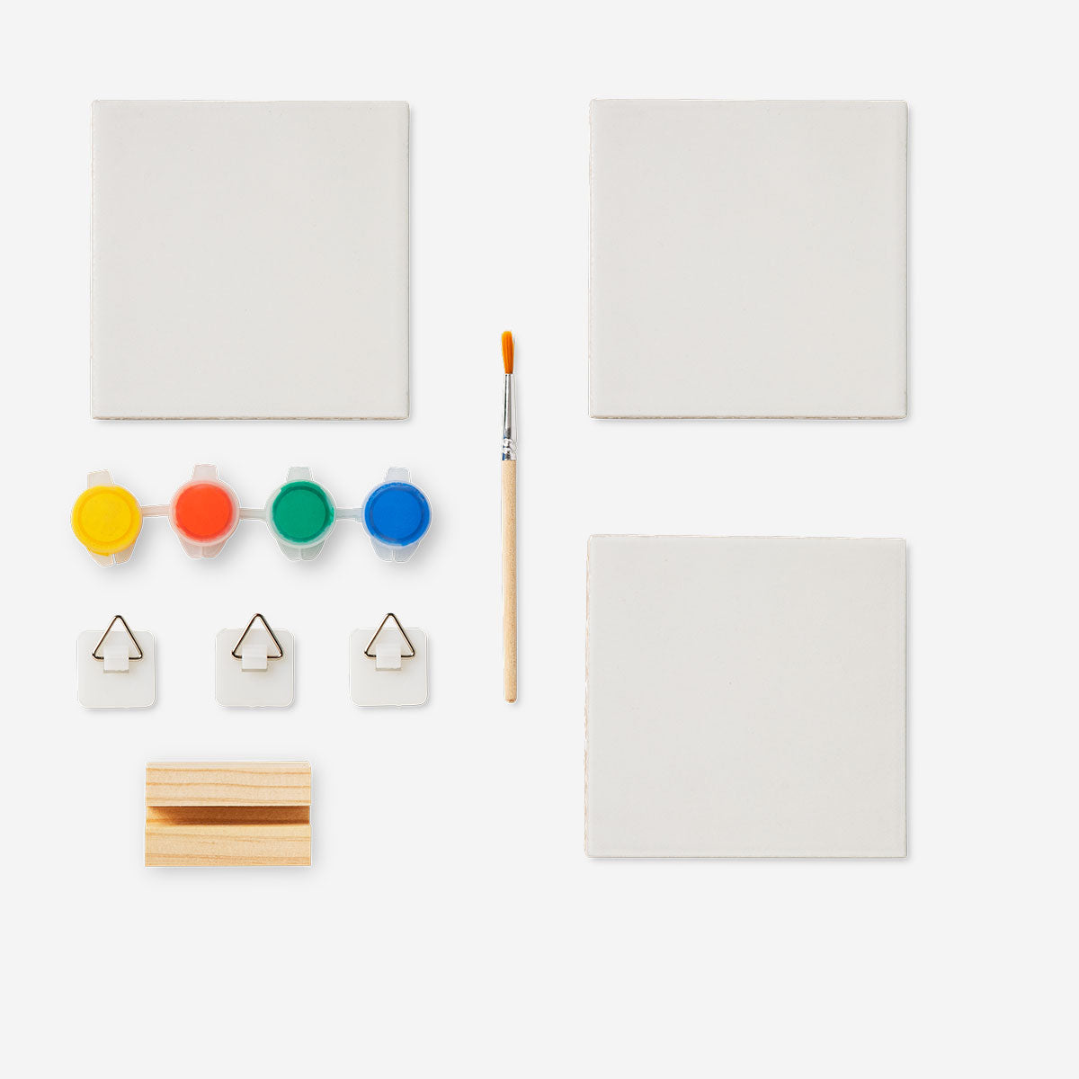 Set of three DIY ceramic tiles from Flying Tiger Copenhagen, featuring colorful patterns for craft projects and home decor.