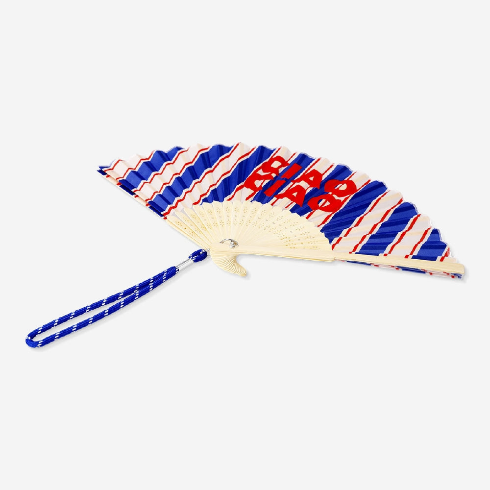 Foldable bamboo fan with Ciao Ciao print and strap, lightweight textile fan by Flying Tiger Copenhagen, perfect for warm weather.