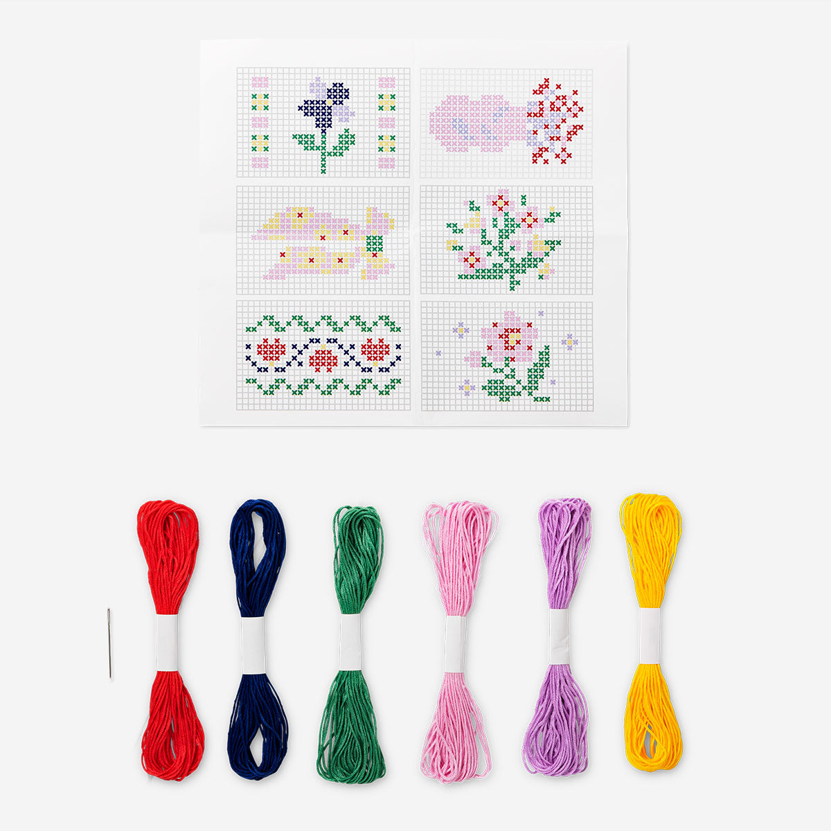 Embroidery kit in a wooden box by Flying Tiger Copenhagen, featuring colorful threads and embroidery accessories inside.
