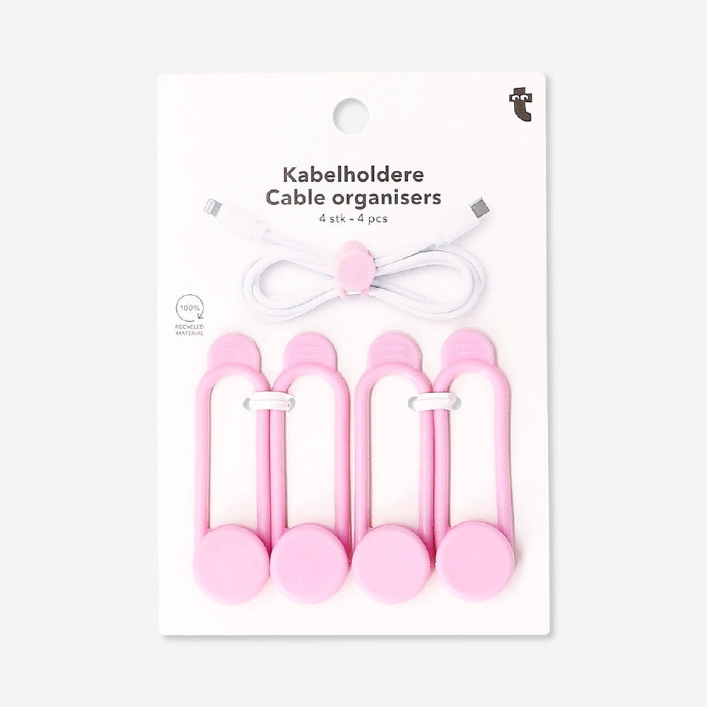 Pink media cable organizers, set of 4, from Flying Tiger Copenhagen, neatly arranged to manage and store electronic cords.