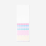 Decorative office paper with colorful stickers from Flying Tiger Copenhagen, featuring playful patterns and creative designs.