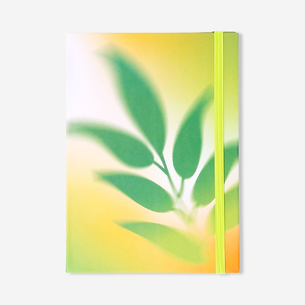 Gradient office notepad with matching pen and sticky notes from Flying Tiger Copenhagen, perfect for organizing notes.