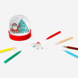 Hobby DIY snowglobe by Flying Tiger Copenhagen featuring a clear glass globe with festive scene inside and a metal base.