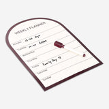 Magnetic weekly planner board with marker from Flying Tiger Copenhagen, featuring a clean office design for organizing weekly schedules.