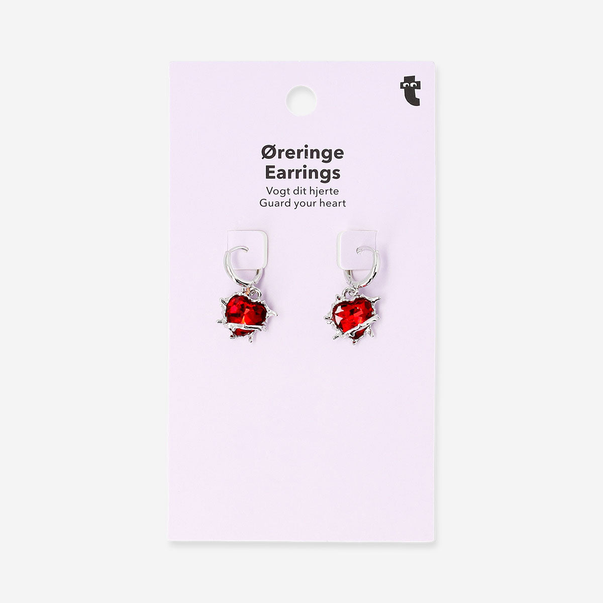 Red heart-shaped textile earrings with spike details hanging from silver hooks, stylish and playful accessory.