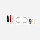 Skull makeup kit with adhesive rhinestones, personal care set by Flying Tiger Copenhagen, featuring face paint and decorative stones.