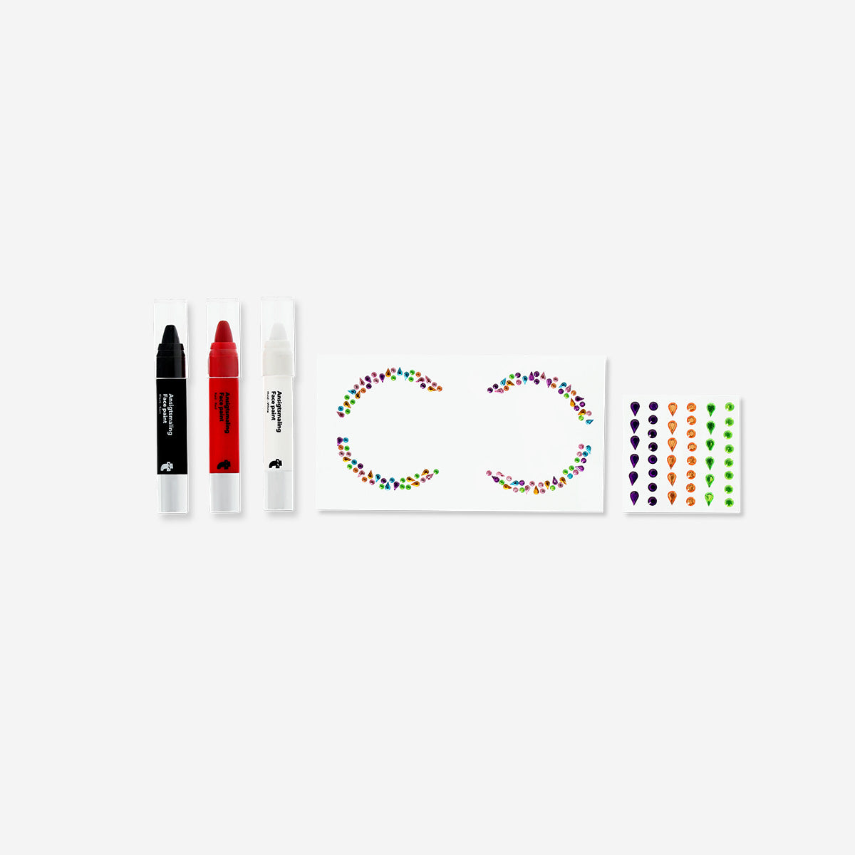 Skull makeup kit with adhesive rhinestones, personal care set by Flying Tiger Copenhagen, featuring face paint and decorative stones.
