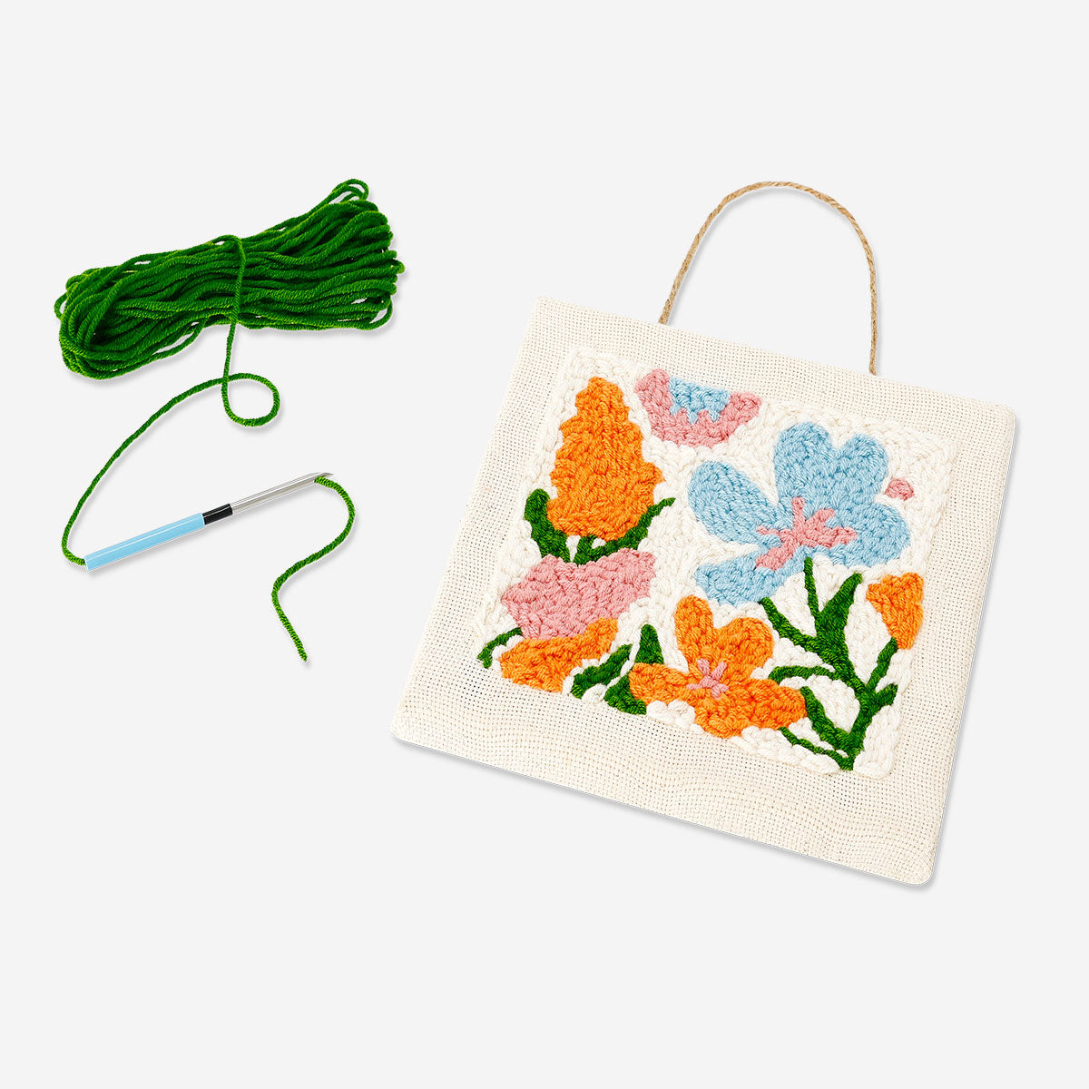 Flying Tiger Copenhagen punch needle set for floral wall art crafting, includes colorful embroidery tools and materials.