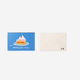 Flying Tiger Copenhagen birthday card featuring a colorful pop-up cake slice design for celebrating special occasions.