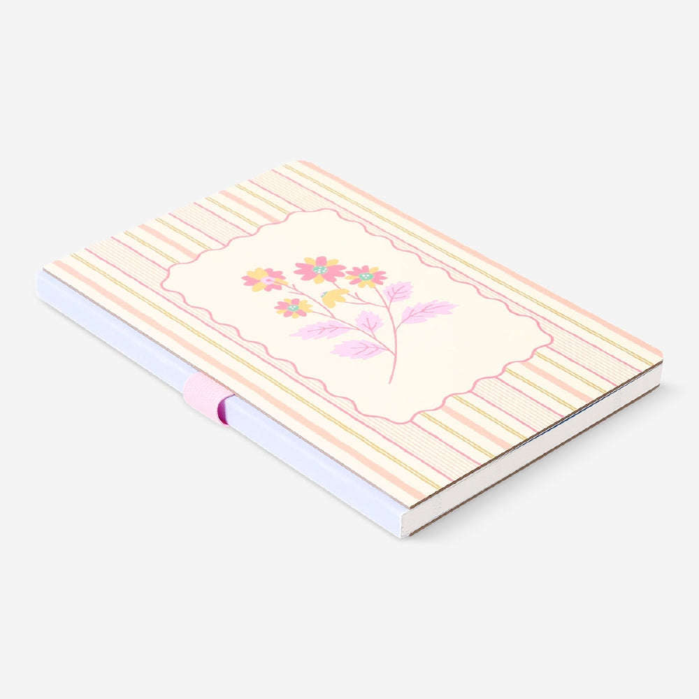 Colorful floral weekly planner from Flying Tiger Copenhagen with pages for organizing weekly schedules and tasks.