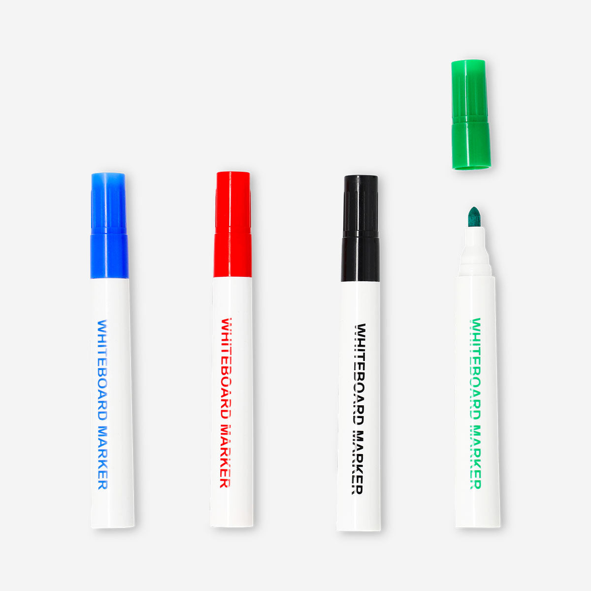 Set of four Flying Tiger Copenhagen whiteboard markers with colorful caps for office and classroom use.