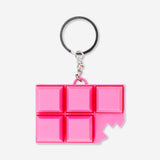 Pink chocolate bar clicking toy keyring from Flying Tiger Copenhagen, featuring a playful gadget design with a clickable chocolate bar shape.