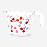 Kitchen measuring cup with cherry print from Flying Tiger Copenhagen, featuring clear measurement markings and a playful cherry design.
